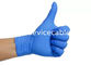 Les gants jetables texturisés de nitriles bleus chirurgicaux saupoudrent librement